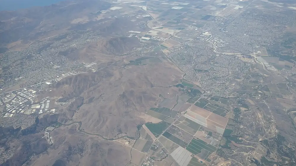 Camarillo seen from the air looking west, with neighborhoods, farm fields and hills