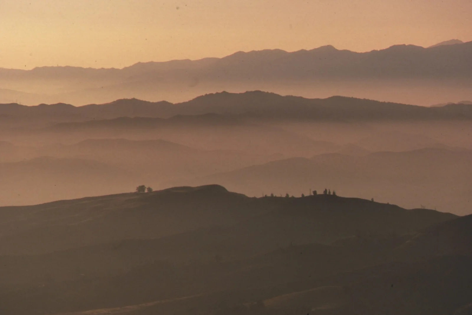 morning fog lying in layers over low hills